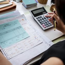 Asian woman working through paperwork